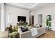 Living room with comfortable seating and city views at 40 12Th Ne St # 1004, Atlanta, GA 30309