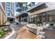 Community patio with seating, grills and dining tables at 40 12Th Ne St # 1004, Atlanta, GA 30309
