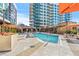 Resort-style pool with ample lounge chairs and umbrellas at 40 12Th Ne St # 1004, Atlanta, GA 30309