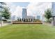 Expansive turf lawn with city views and benches at 40 12Th Ne St # 1004, Atlanta, GA 30309