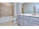 Main bathroom with shower and double vanity at 6166 Ripple Way # 79, South Fulton, GA 30349
