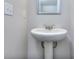 Small bathroom with pedestal sink and mirror at 6166 Ripple Way # 79, South Fulton, GA 30349