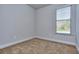 Simple carpeted bedroom with a window at 6166 Ripple Way # 79, South Fulton, GA 30349