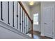 Entryway with staircase and coat closet, featuring wood and wrought iron at 6166 Ripple Way # 79, South Fulton, GA 30349