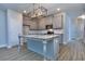 Modern kitchen with gray cabinets and granite island at 6166 Ripple Way # 79, South Fulton, GA 30349