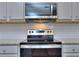 Stainless steel appliances and granite countertops in kitchen at 6166 Ripple Way # 79, South Fulton, GA 30349