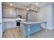 Modern kitchen with stainless steel appliances and an island at 6166 Ripple Way # 79, South Fulton, GA 30349