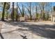 Large backyard with basketball court and storage shed at 1980 Campfire Dr, Riverdale, GA 30296