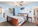 Bright bedroom with a king-size bed and wood floors at 1980 Campfire Dr, Riverdale, GA 30296