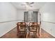 Bright dining room with hardwood floors and a wooden dining table at 1980 Campfire Dr, Riverdale, GA 30296