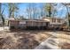 Brick ranch house with a two-car attached garage and a large backyard at 1980 Campfire Dr, Riverdale, GA 30296