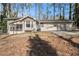 Ranch house with screened porch and two-car garage at 1980 Campfire Dr, Riverdale, GA 30296