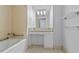 Bathroom with granite vanity, tiled floors, and bathtub at 3338 Peachtree Ne Rd # 1104, Atlanta, GA 30326