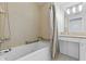 Bathroom with tub and shower, granite vanity and tiled walls at 3338 Peachtree Ne Rd # 1104, Atlanta, GA 30326