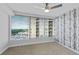 Bedroom with city view, ceiling fan, and carpet at 3338 Peachtree Ne Rd # 1104, Atlanta, GA 30326