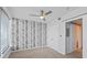 Bedroom with birch tree wallpapwer, ceiling fan, and carpet at 3338 Peachtree Ne Rd # 1104, Atlanta, GA 30326