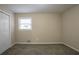 Comfortable bedroom featuring neutral walls, carpet, a window, and a closet creating a tranquil living space at 3482 Scenic Dr, Atlanta, GA 30344