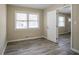 Bedroom with a window overlooking the front yard, wood floors, and a neutral color scheme at 3482 Scenic Dr, Atlanta, GA 30344