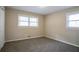 Bright bedroom featuring neutral walls, plush carpet, and two windows allowing for natural light at 3482 Scenic Dr, Atlanta, GA 30344