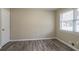 Cozy bedroom featuring hardwood floors, a neutral color scheme, and a window for natural light at 3482 Scenic Dr, Atlanta, GA 30344