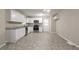 Bright kitchen featuring white cabinets, stainless steel appliances, granite countertops, and tile flooring at 3482 Scenic Dr, Atlanta, GA 30344