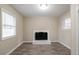 Living room with hardwood floors, a fireplace, and large windows that provide plenty of natural light at 3482 Scenic Dr, Atlanta, GA 30344