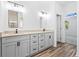 Bathroom featuring granite countertops, double sinks, and wood-look flooring at 485 N Oakland Cir, Mcdonough, GA 30253