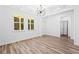 Bright dining room with coffered ceilings and modern chandelier at 485 N Oakland Cir, Mcdonough, GA 30253