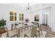 Bright dining room with coffered ceilings and modern chandelier, perfect for entertaining at 485 N Oakland Cir, Mcdonough, GA 30253