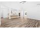 Spacious living room with wood-look laminate flooring flows into the open-concept kitchen at 485 N Oakland Cir, Mcdonough, GA 30253