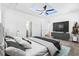 Spacious main bedroom featuring a tray ceiling with a fan at 485 N Oakland Cir, Mcdonough, GA 30253