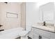 Bathroom featuring a modern vanity with granite countertop and tile-surround shower at 485 N Oakland Circle, Mcdonough, GA 30253