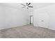 Bedroom with grey carpet, ceiling fan and double door closet at 485 N Oakland Circle, Mcdonough, GA 30253