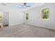 Main bedroom with carpeted floor and a tray ceiling at 485 N Oakland Circle, Mcdonough, GA 30253