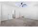 Bedroom showcasing open doorways and carpet, and a modern ceiling fan at 485 N Oakland Circle, Mcdonough, GA 30253