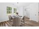 Bright breakfast nook with a modern chandelier and view to the private back yard at 485 N Oakland Circle, Mcdonough, GA 30253