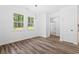 Bright dining room with hardwood floors and modern chandelier at 485 N Oakland Circle, Mcdonough, GA 30253