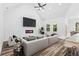 Bright living room with fireplace and tv, and a white vaulted ceiling at 485 N Oakland Circle, Mcdonough, GA 30253