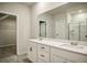 Double vanity bathroom with large mirror and shower at 576 Rodeo Dr, Auburn, GA 30011