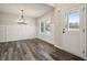 Formal dining room with chandelier and wainscoting at 576 Rodeo Dr, Auburn, GA 30011