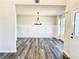 Bright dining room with chandelier and wainscoting at 576 Rodeo Dr, Auburn, GA 30011