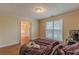 Bright bedroom with wood floors and view into another room at 601 Rangeley Meadows Ct, Hampton, GA 30228