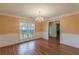 Bright dining room with hardwood floors and chandelier at 601 Rangeley Meadows Ct, Hampton, GA 30228