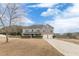 Brick house with a two-car garage and manicured lawn at 601 Rangeley Meadows Ct, Hampton, GA 30228