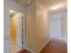 Hallway with light walls and wood flooring at 601 Rangeley Meadows Ct, Hampton, GA 30228