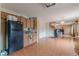 Kitchen with stainless steel appliances and view into living room at 601 Rangeley Meadows Ct, Hampton, GA 30228