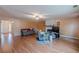 Living room featuring hardwood floors and a fireplace at 601 Rangeley Meadows Ct, Hampton, GA 30228