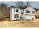 Two-story house with gray siding, red door, and a two-car garage at 82 Summer Creek Pl, Dallas, GA 30157