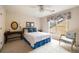 Bright bedroom featuring a queen-size bed and window at 1440 Vinery Ave, Cumming, GA 30041