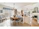 Charming breakfast nook with a rustic wood table and built-in bench seating at 1440 Vinery Ave, Cumming, GA 30041